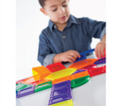 Child playing with Guidecraft Magnetic PowerClix Solids 44 Pieces. Available from tenlittle.com