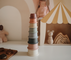 Mushie Stacking Cups on a table. Available from tenlittle.com
