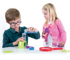 Boy and girl playing with Thames & Kosmos Science Laboratory. Available from tenlittle.com