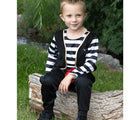 Child wearing Little Adventures Pirate Costume while sitting down on the grass. Available from tenlittle.com