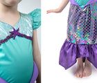Two views of child wearing Little Adventures Purple Sparkle Mermaid costume. Available from tenlittle.com