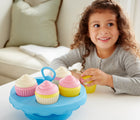 Girl playing with Green Toys 100% Recycled Pretend Cupcake Set next to the couch. Available from tenlittle.com