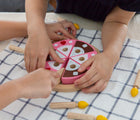 Kids playing with PlanToys Birthday Cake Set. Available from tenlittle.com
