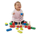 Child playing with Melissa & Doug Stacking Train. Available from tenlittle.com