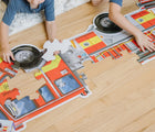 Children playing with Melissa & Doug Fire Truck Floor Puzzle - 24 Pieces on the floor. Available from tenlittle.com