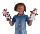Child with cow hand puppet in one hand and horse hand puppet in another hand from Melissa & Doug Farm Friends Hand Puppets. Available from tenlittle.com 