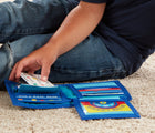 Child's hands holding Melissa & Doug Pretend-to-Spend Wallet while sitting on the floor. Available from tenlittle.com