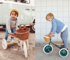 Child using Banwood Trike in cream and another child using Banwood Trike in green. Available from tenlittle.com