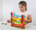 Girl playing with Bigjigs Car Racer. Available from www.tenlittle.com.