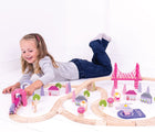 Girl playing with Bigjigs Fairy Town Train Set. Available from www.tenlittle.com.