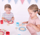 Kids having a tea party with Bigjigs Dinner Set 20 Pieces. Available from www.tenlittle.com.