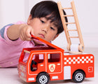 Boy playing with Bigjigs Fire Engine. Available from www.tenlittle.com.