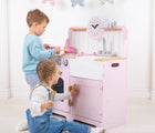 Kids playing with Bigjigs Country Play Kitchen. Available from www.tenlittle.com.